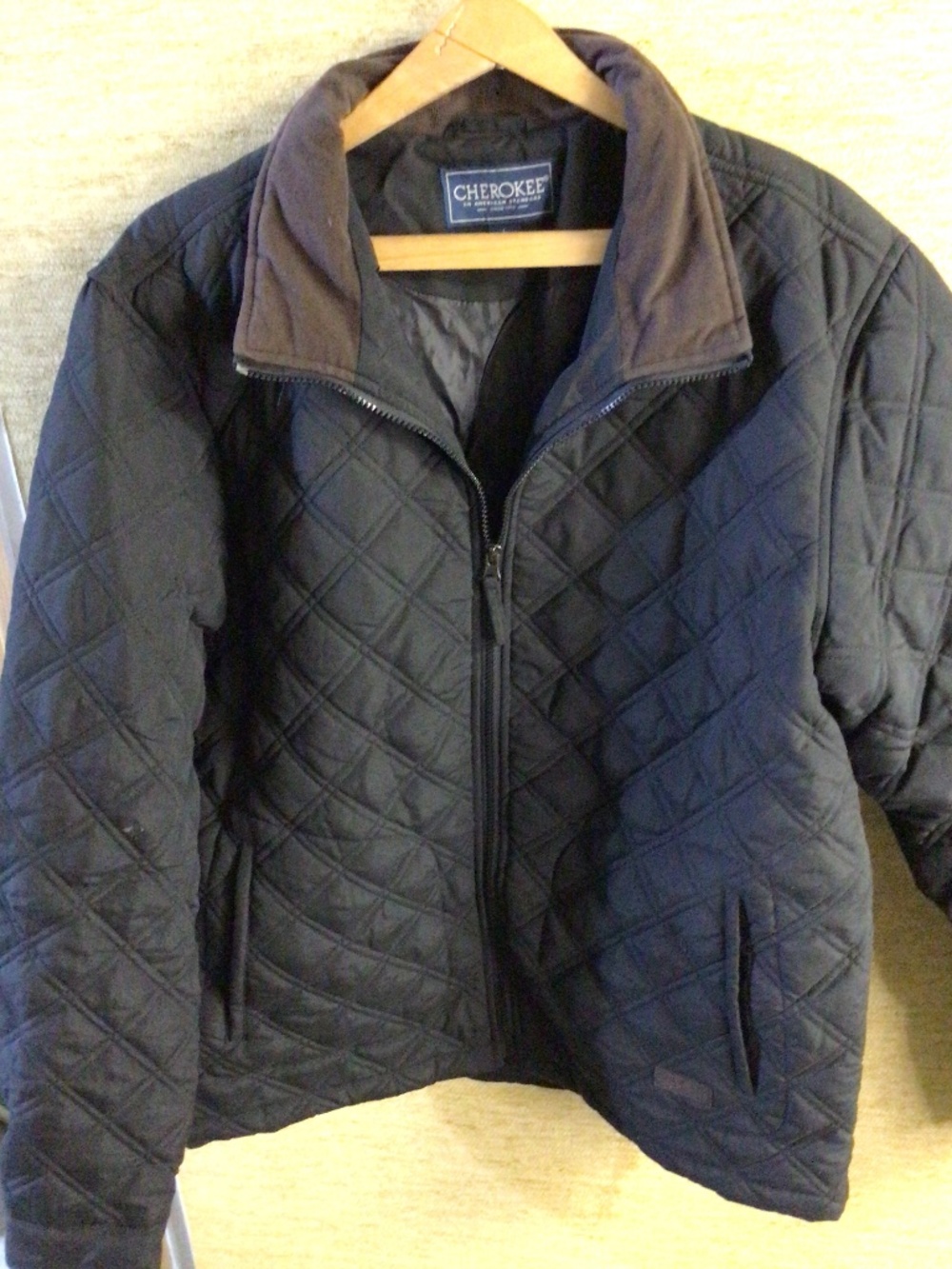 Men’s size large Cherokee quilted jacket with brown accents on collar and cuffs
